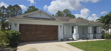 Ranch-style house with an attached garage, concret