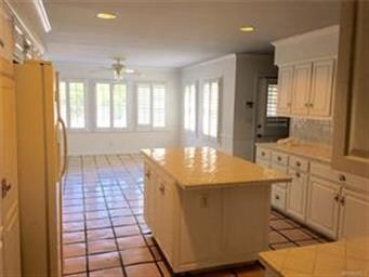 Kitchen is huge! And very neutral.