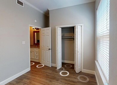 Unfurnished bedroom with multiple windows, orname