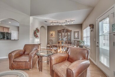 Great room looking in to dining room and pass through in to kitchen.
