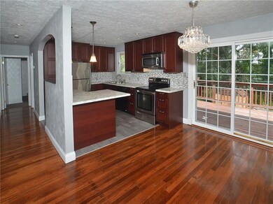 New granite kitchen with glass backsplash and pend
