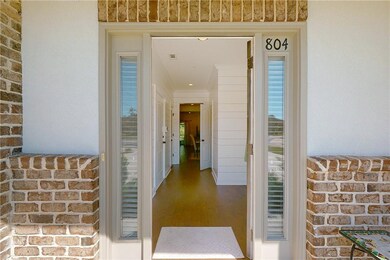 Beautiful inviting foyer with hardwood floors and