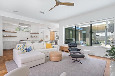 Living area featuring plenty of natural light, li