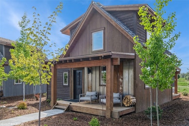 Rear view of property with a wooden deck