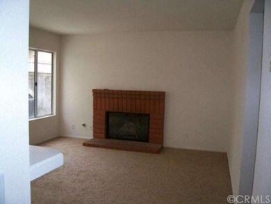 Family Room with large windows & slider to the rea