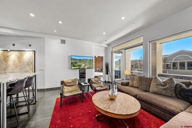 Living room with recessed lighting, visible vents,