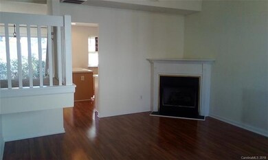 Great room with vaulted ceiling and fireplace