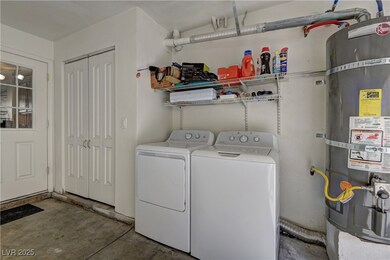 Laundry area featuring secured water heater and wa