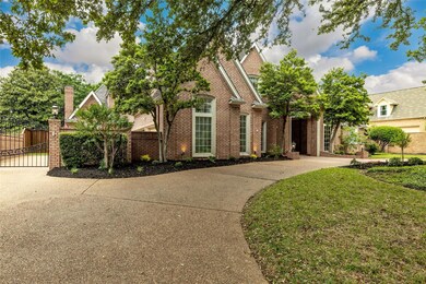 Circular drive with gated 3 car side swing garage.