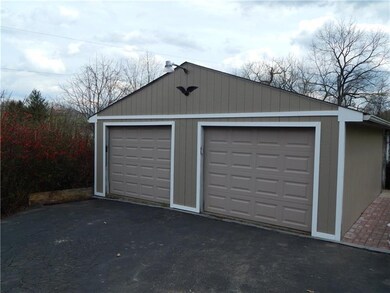 Large 4-car Garage plus additional parking on the 