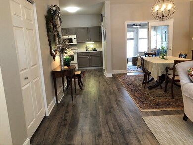 OPEN FLOOR PLAN WITH NEWER HARDWOOD FLOORING