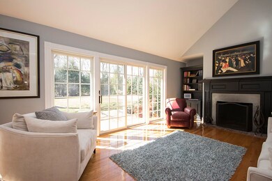 Sun flooded living room leading to outdoor patio