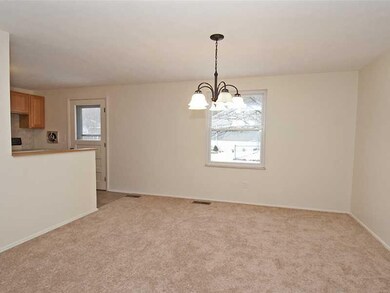 Dining Room. New lighting, carpet and paint in thi
