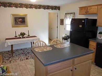 Cafeteria/Kitchen. View of island and breakfast area.