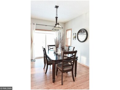 Dinner room looks out the sliding glass door to th