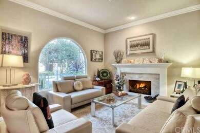 Formal Living Room With Marble Fireplace, Crown Mo