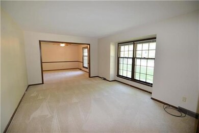 Large formal living room with double window for lo