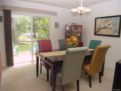 Dining room  has glass doors to a deck