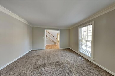 Spare room with ornamental molding, carpet floorin