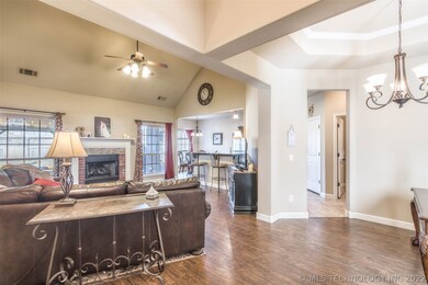 Open floorplan with tall ceilings, wood look floor