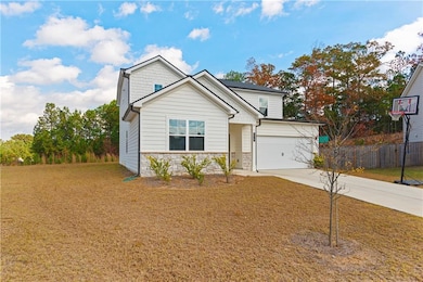 Generous front lawn offers an inviting, open first impression.