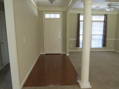 Foyer with hardwood floors.