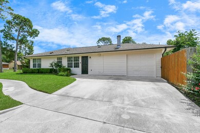 This side of the house features additional parking at your double wide driveway, and another entrance to the home for convenience.