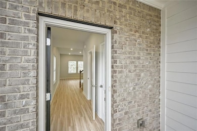 Property entrance with brick siding