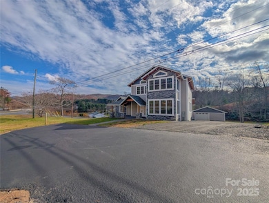 Parking available in paved area, gravel driveway & one car detached garage