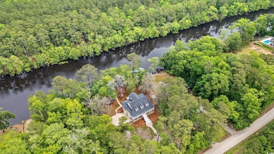 Aerial view of property's location with a nearby b