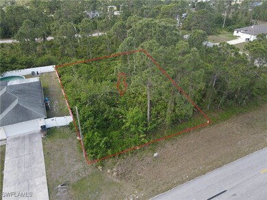 Aerial overview of property's location featuring property parcel outlined