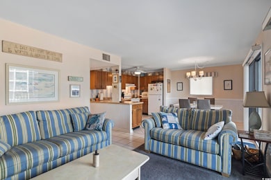 Carpeted living room with ceiling fan with notable