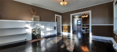 LIVING ROOM LEADS TO DINING AND HALLWAY

