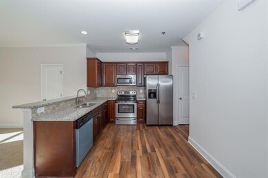 Kitchen with stainless steel appliances, a sink, o