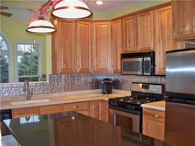 Kitchen. Hickory cabinetry in kitchen with open vi