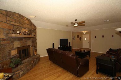 Living area, Corner FPL, Laminate  Flooring.