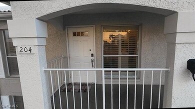 Entrance to property with stucco siding