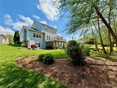 Rear view of house with a yard