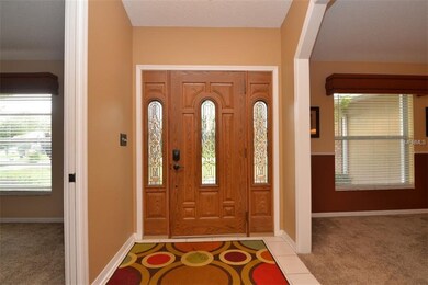 Beautiful foyer entry and front door with lead gla