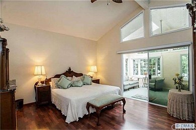 The Master suite upstairs with windows on three si