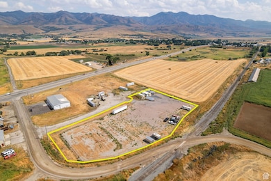 Overview of rural landscape featuring property parcel outlined and mountains