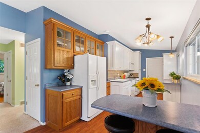 Bright Kitchen with LOTS of custom cabinets, glass