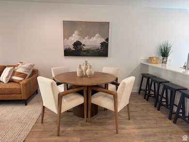 Dining area with wood finished floors