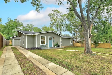 View of front facade with concrete driveway and a