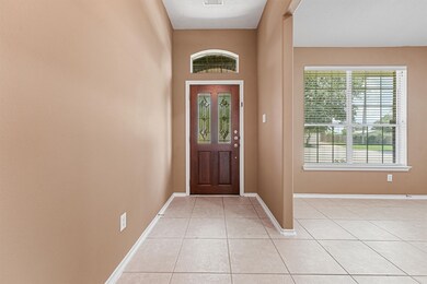 Step inside the foyer to be greeted by warm paint and lovely tile floors. This home also features 2