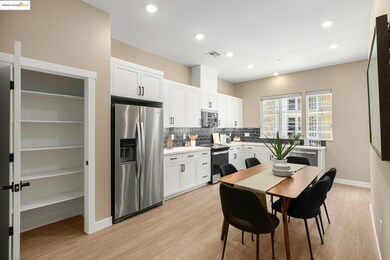 Kitchen with appliances with stainless steel finishes, decorative backsplash, white cabinets, light wood-style floors, and recessed lighting