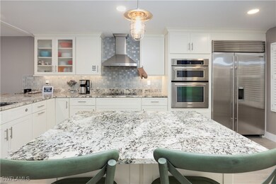 Kitchen featuring backsplash, decorative light fix
