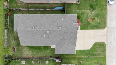 Aerial view of home where you'll notice no rear ne
