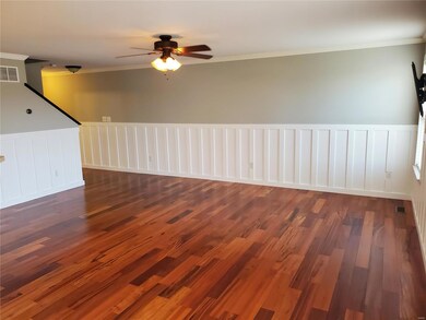 Main level living room with beautiful hardwood floors.