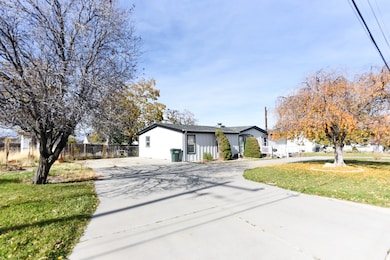 View of front of home featuring driveway and board and batten siding